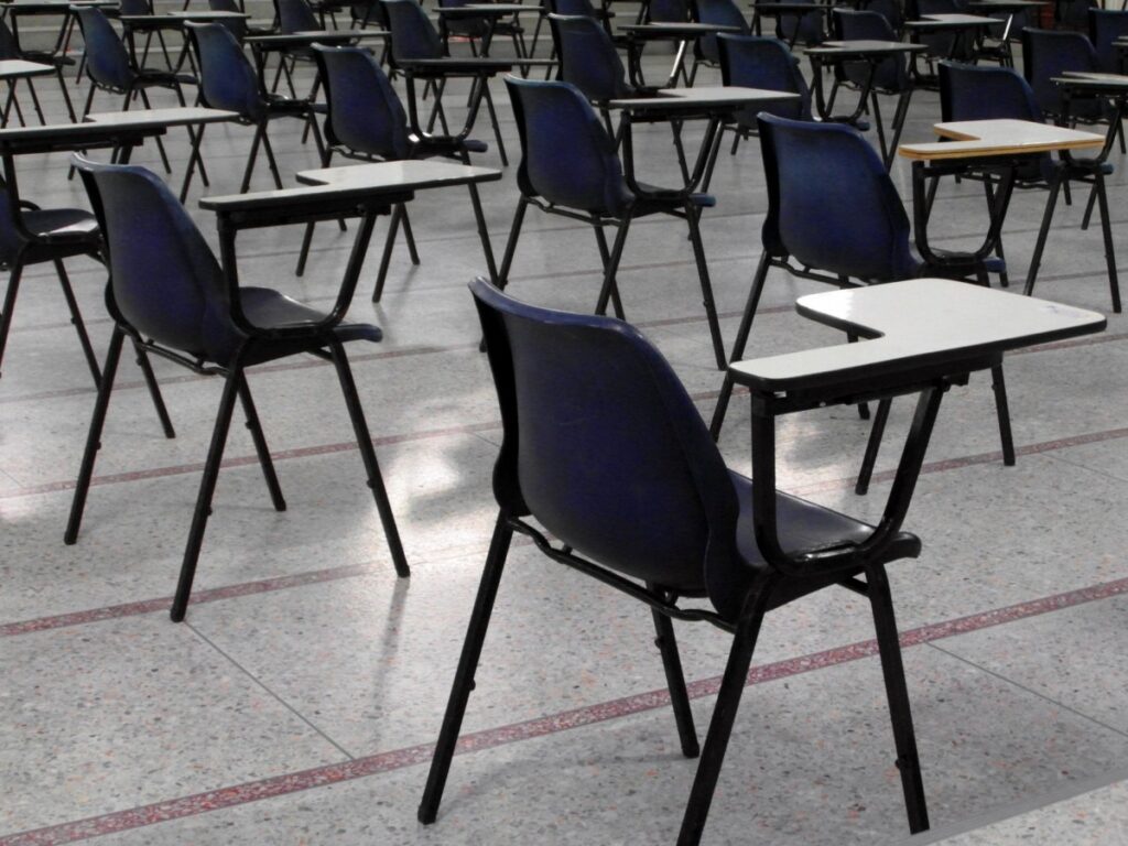 A bunch of empty chairs in a classroom